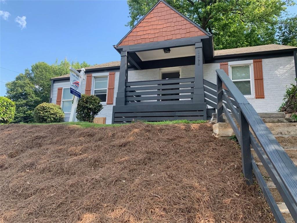 a front view of a house with garden