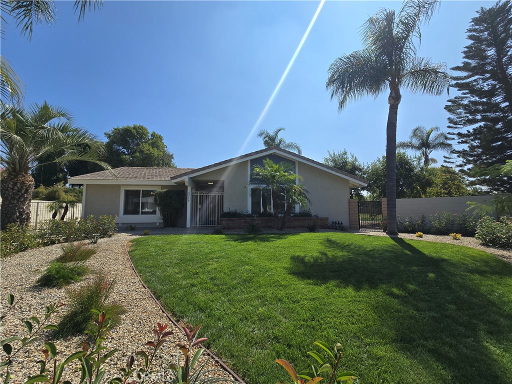 a front view of house with yard and outdoor seating