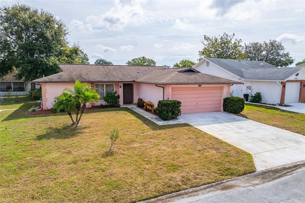 a view of a house with a yard