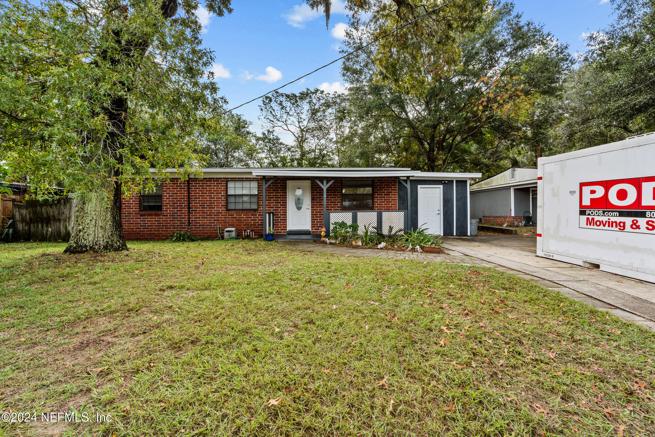 front view of a house with a yard