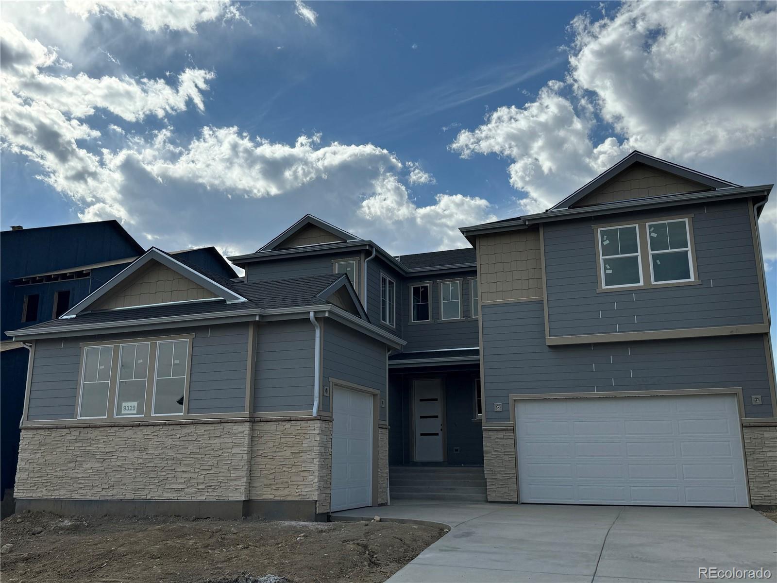 a front view of a house with yard