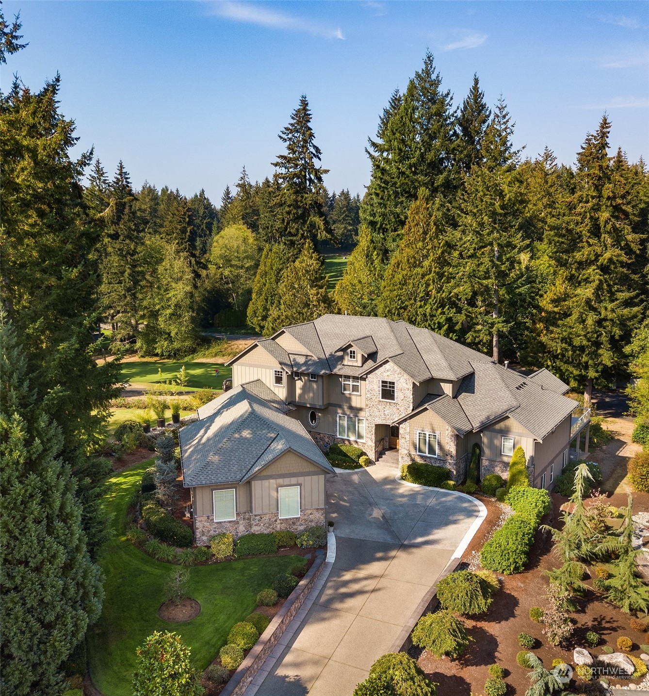 a aerial view of a house with a big yard