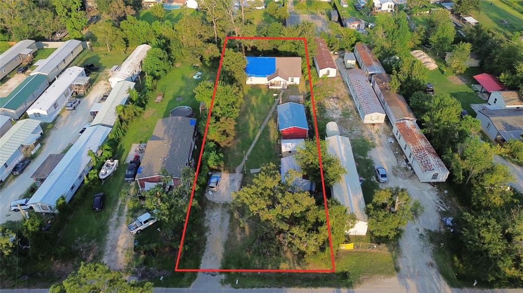 an aerial view of residential houses with outdoor space