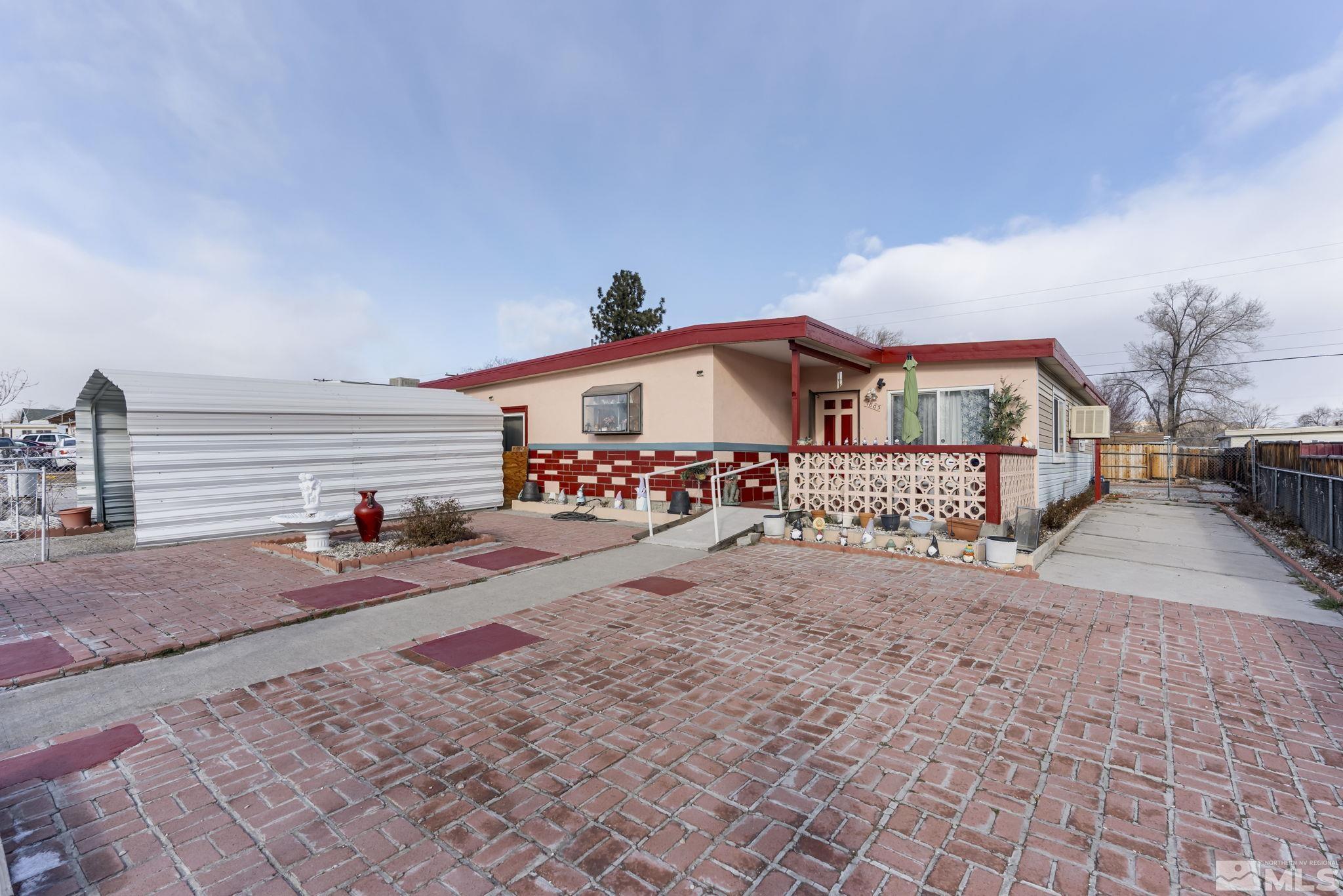 a front view of a house with garage