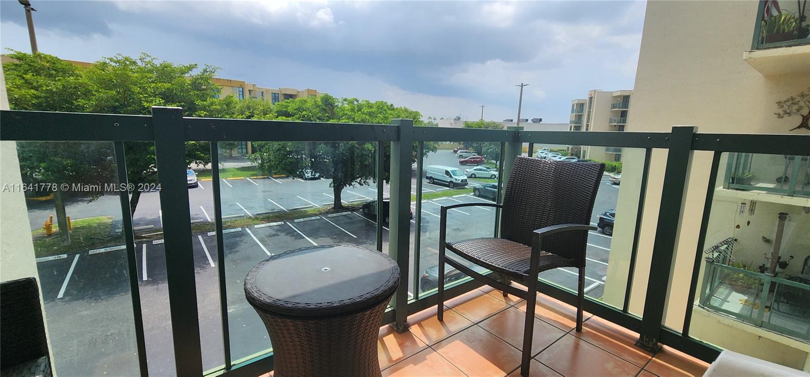 a view of a balcony with chairs