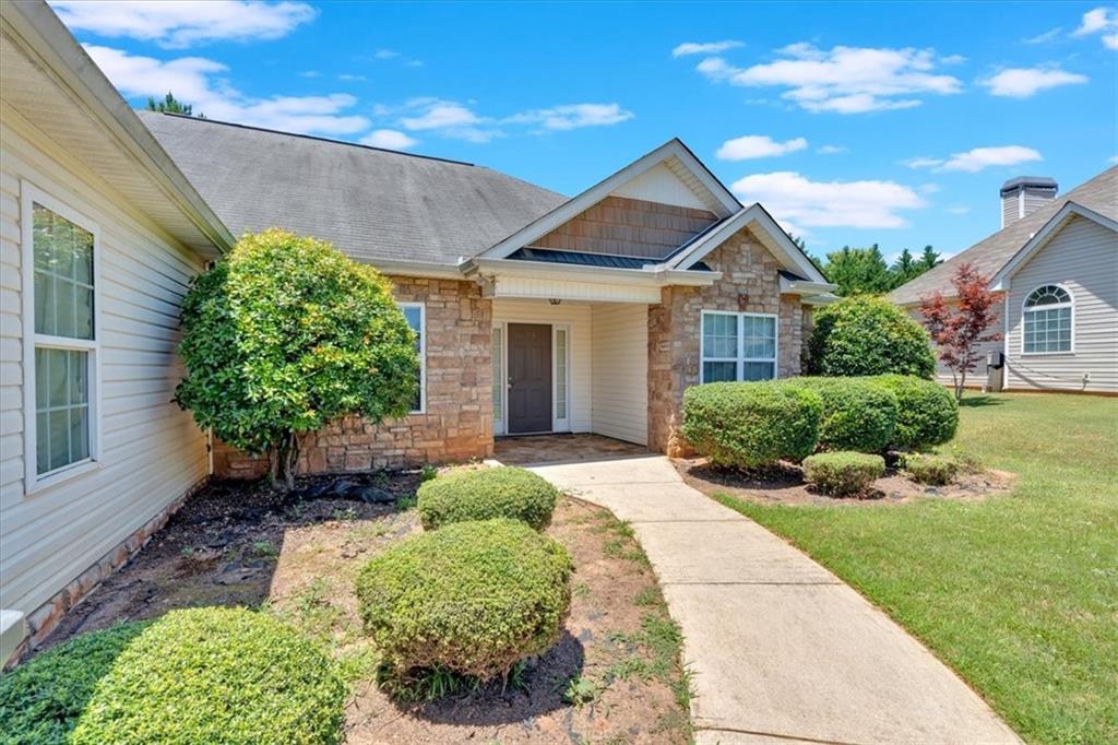 a front view of a house with a yard