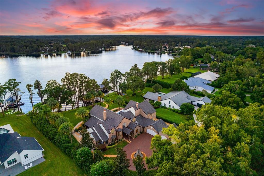 an aerial view of a house with a lake view