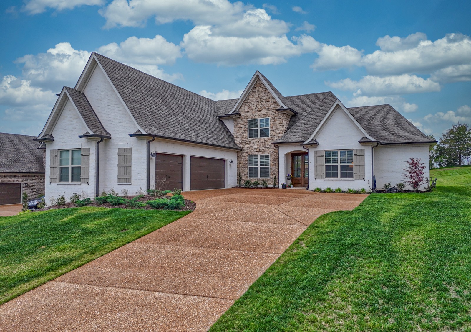 front view of a house with a yard