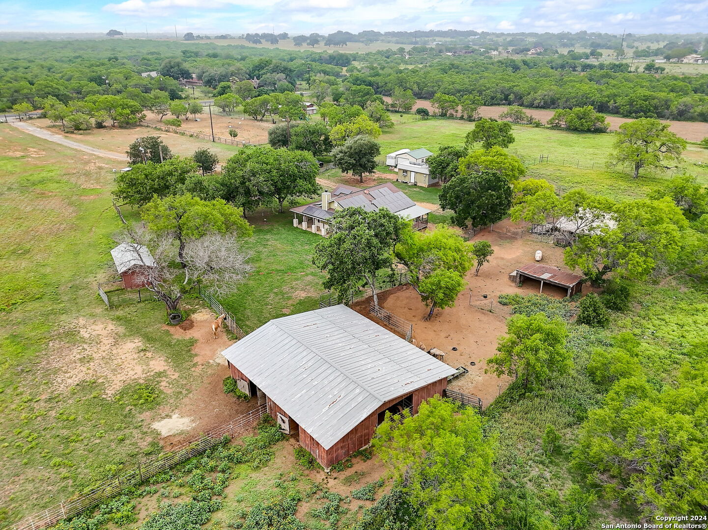 an aerial view of a house having yard