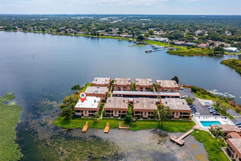 a aerial view of a house with a lake view