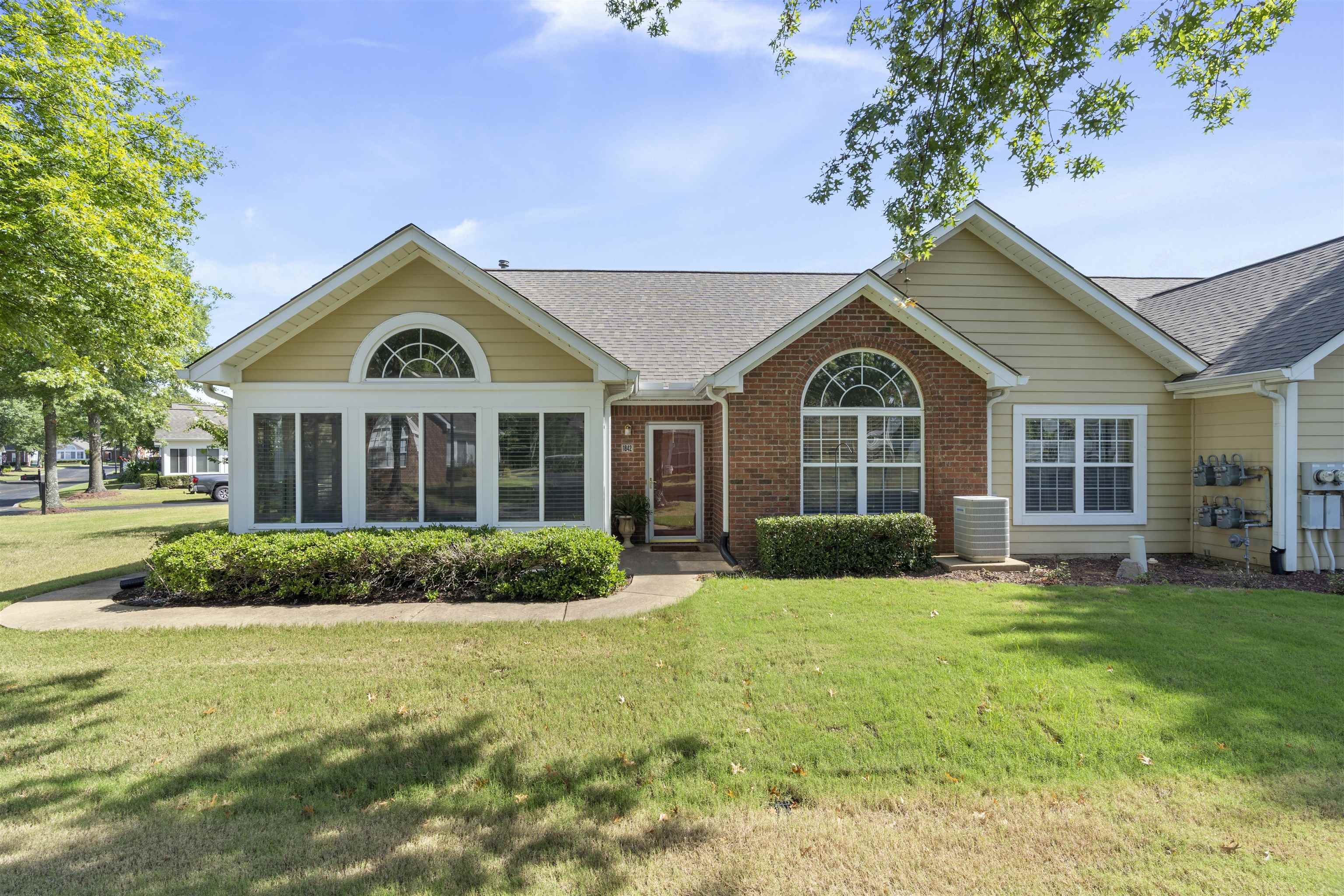 a front view of a house with a yard