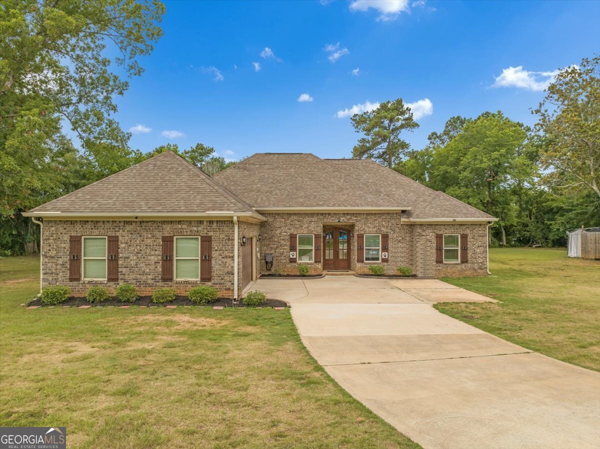 a front view of a house with a yard