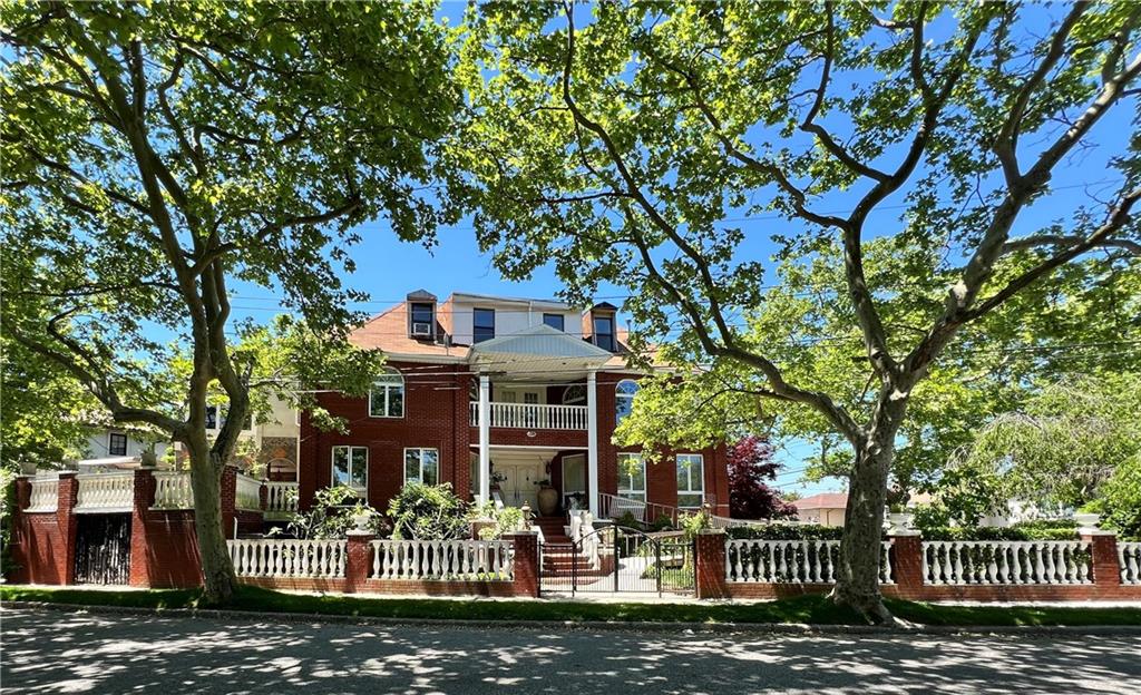 front view of a house with a tree