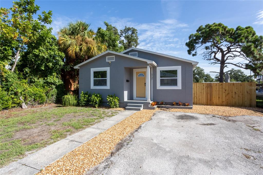 front view of a house with a yard