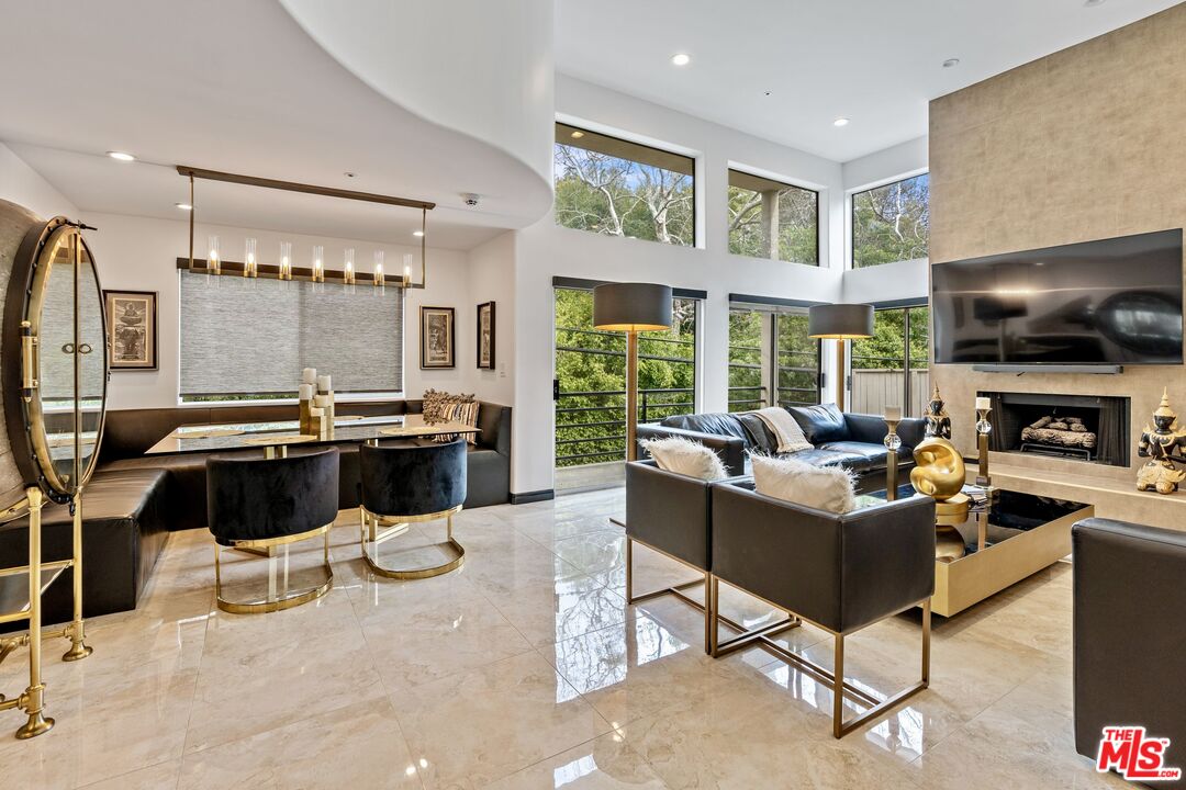 a living room with fireplace furniture and a flat screen tv