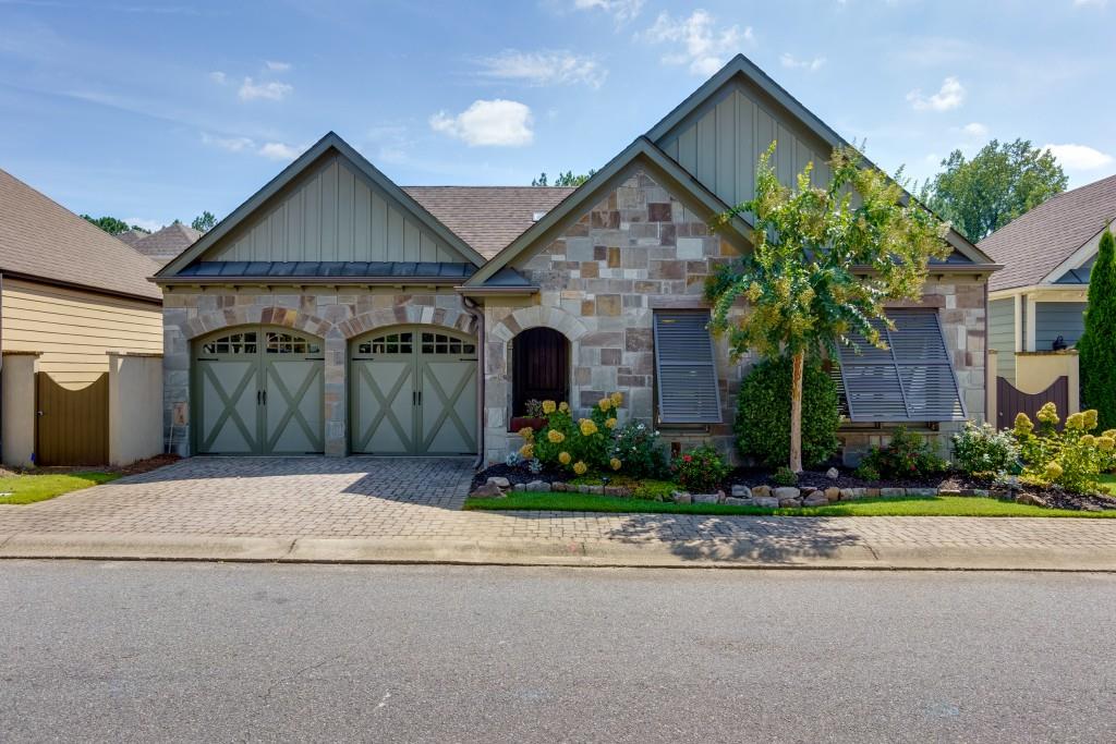 a front view of a house with garden