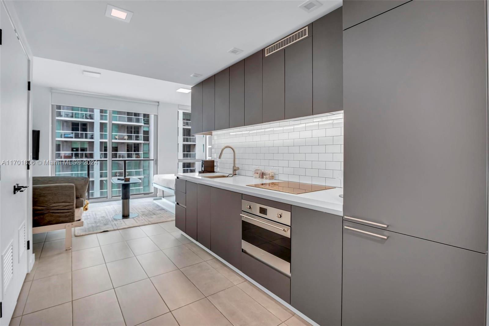 a kitchen with a stove and a refrigerator