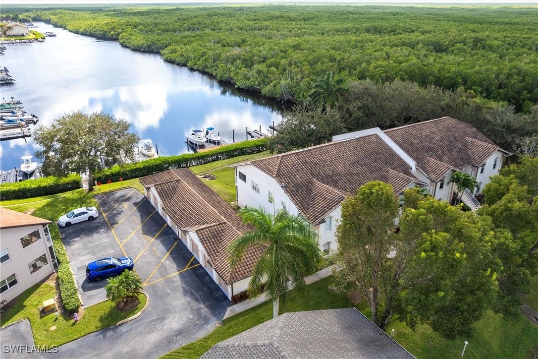 an aerial view of a house with a yard basket ball court and outdoor seating