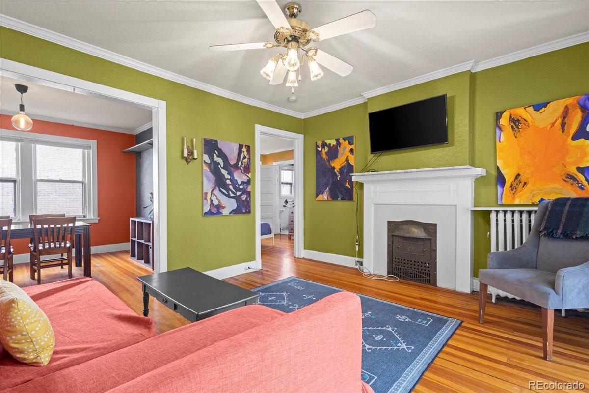 a living room with fireplace furniture and a flat screen tv