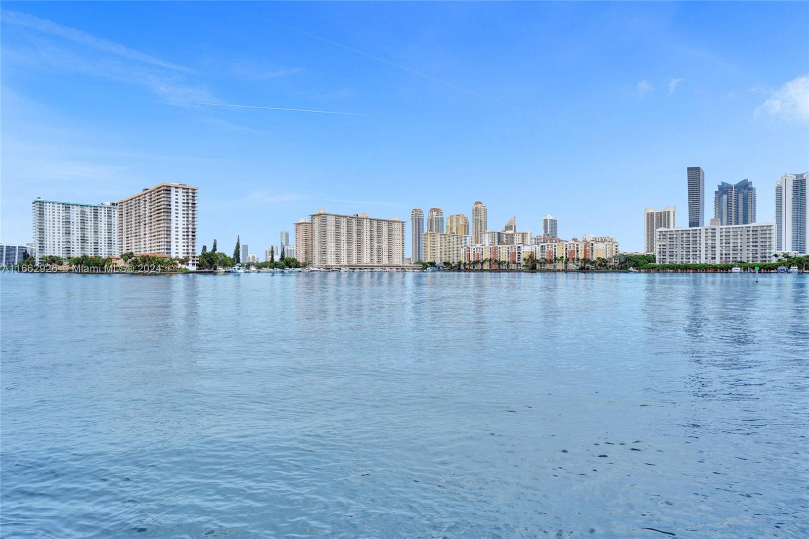 a view of a lake with building in front of it