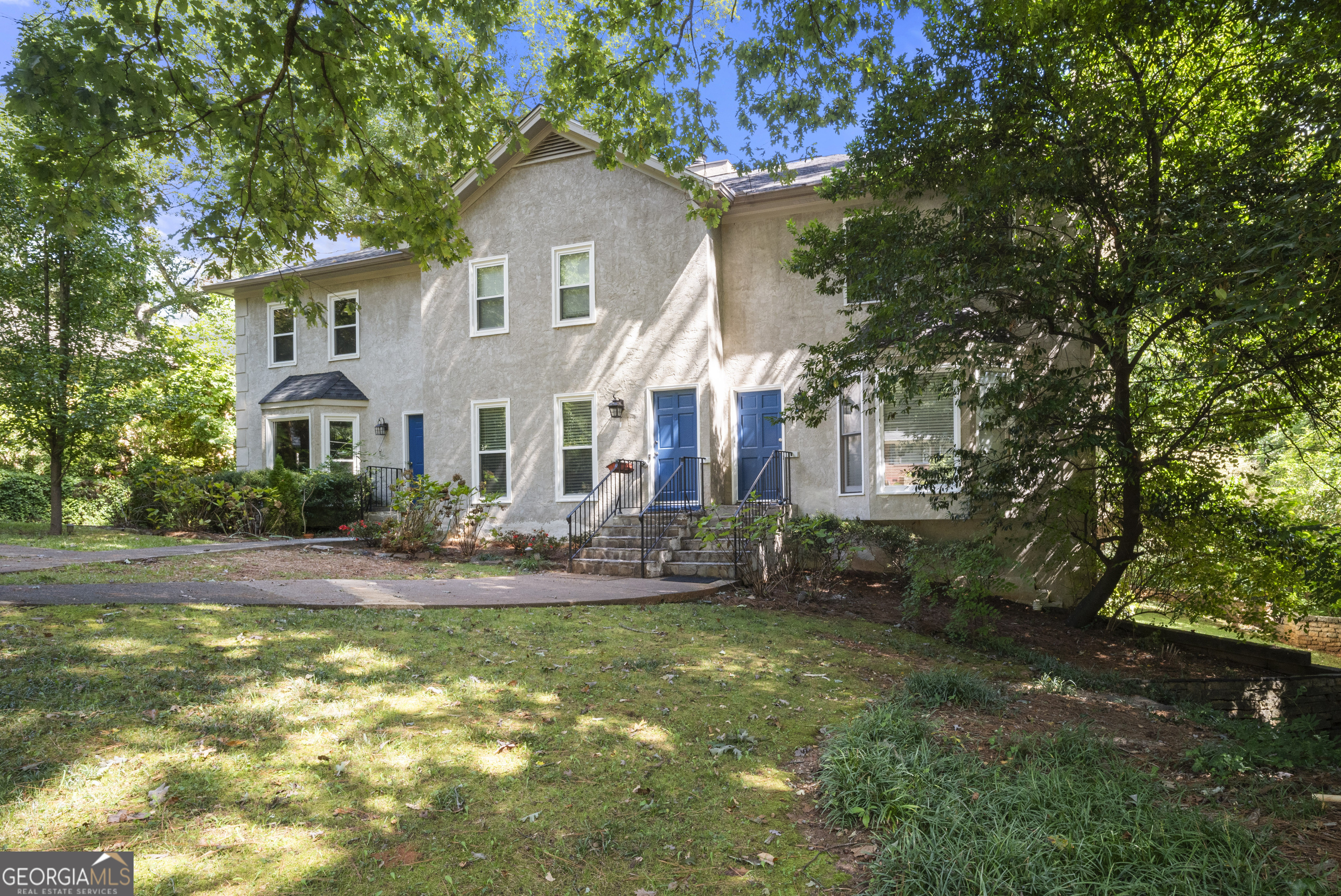 View of front of house. Unit C is end unit on the right.