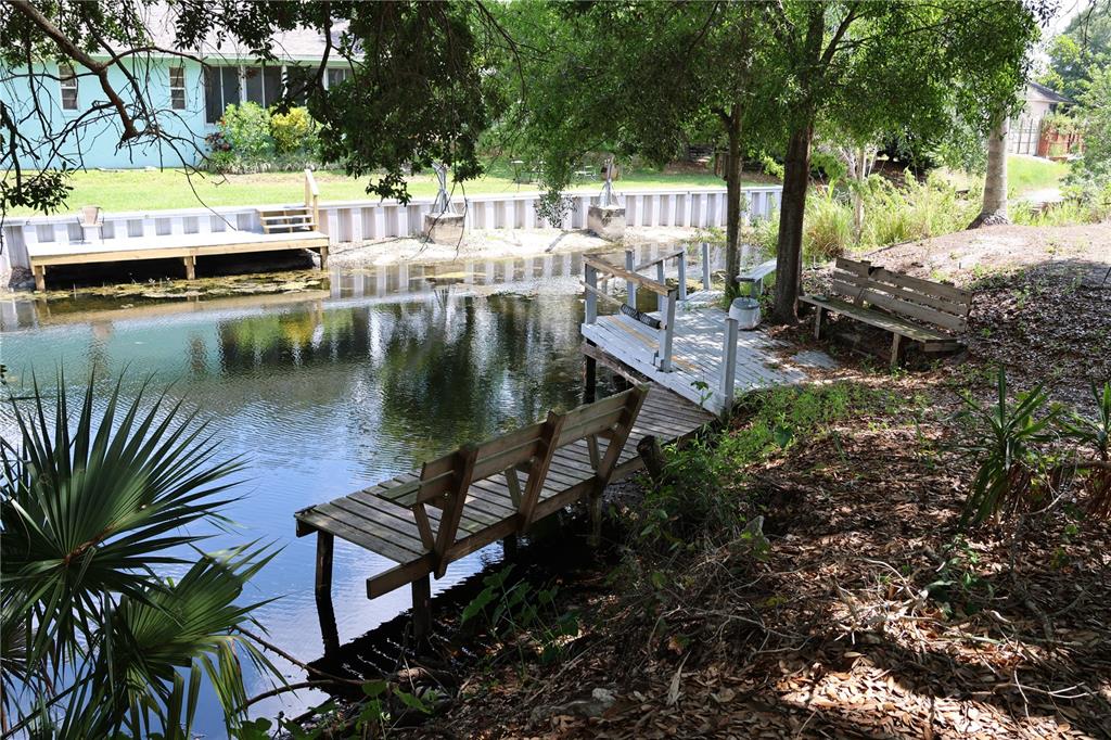 a view of a wooden deck and lake