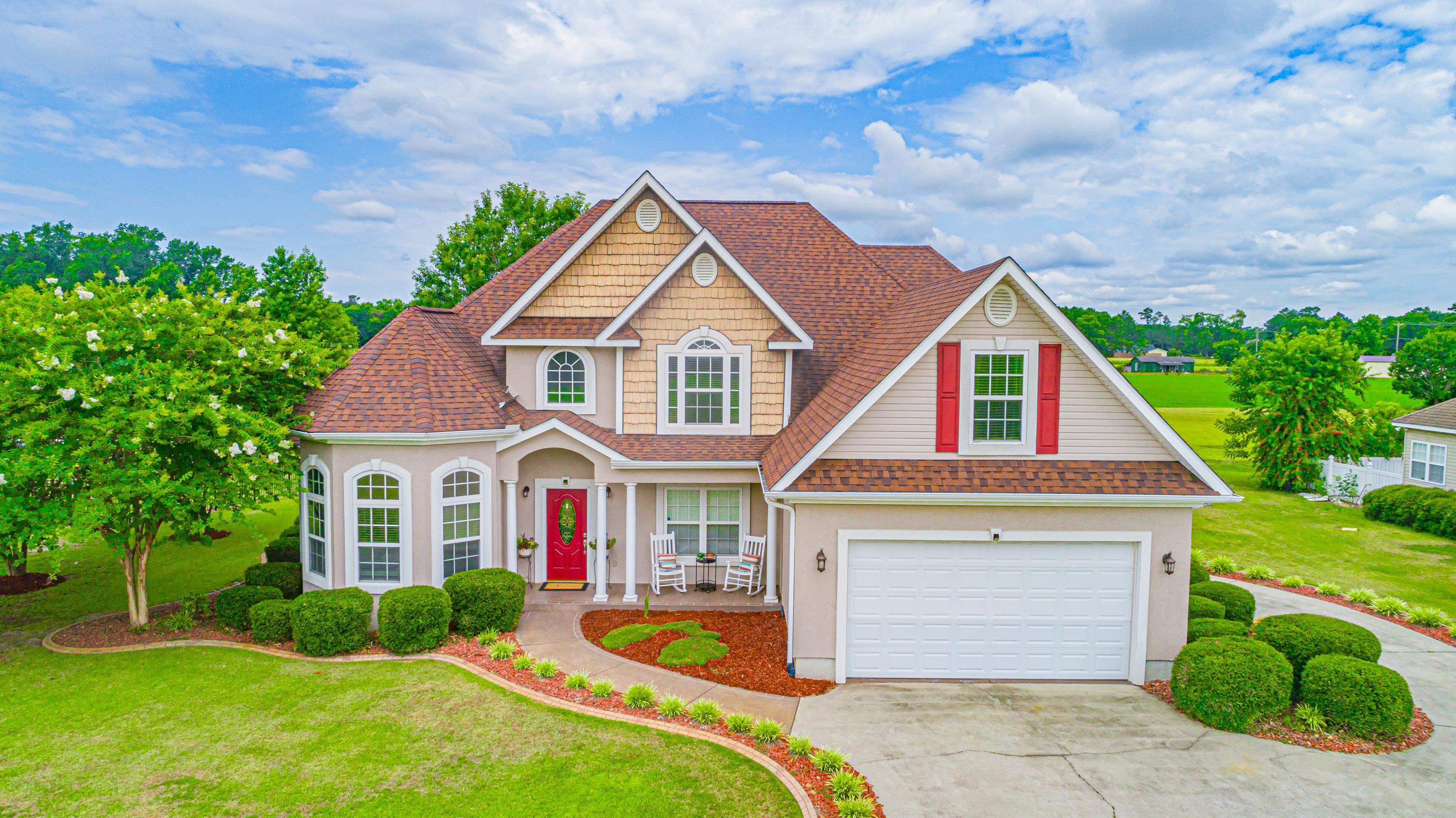 View of front of house featuring a garage and a fr