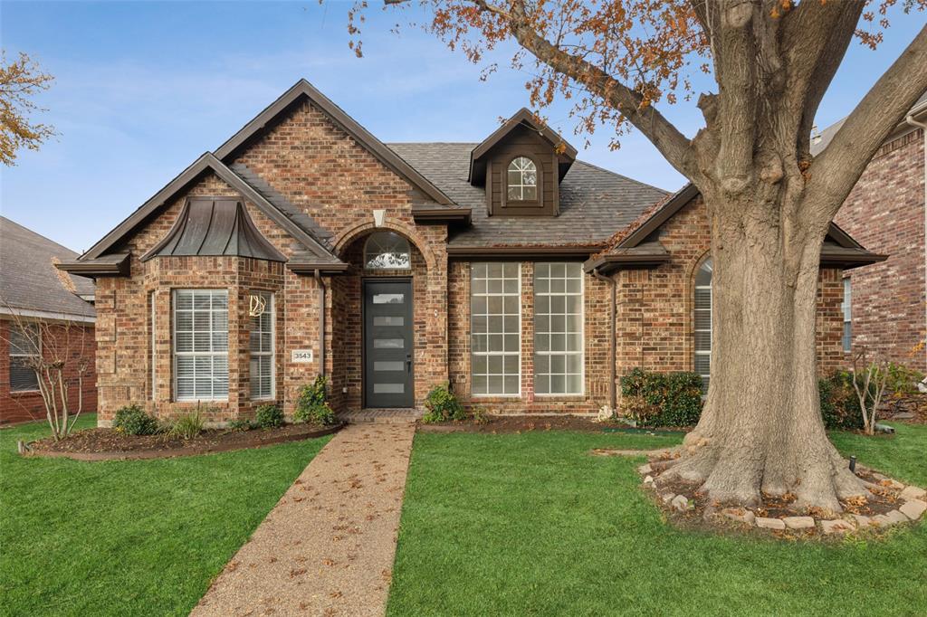 front view of a house with a yard