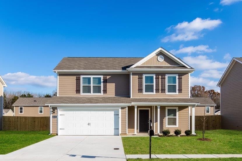 front view of a house with a yard