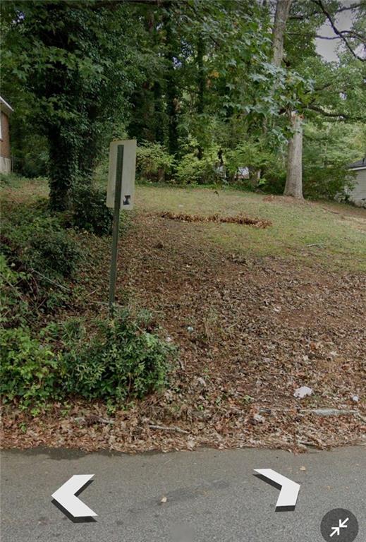 a view of a street with a tree