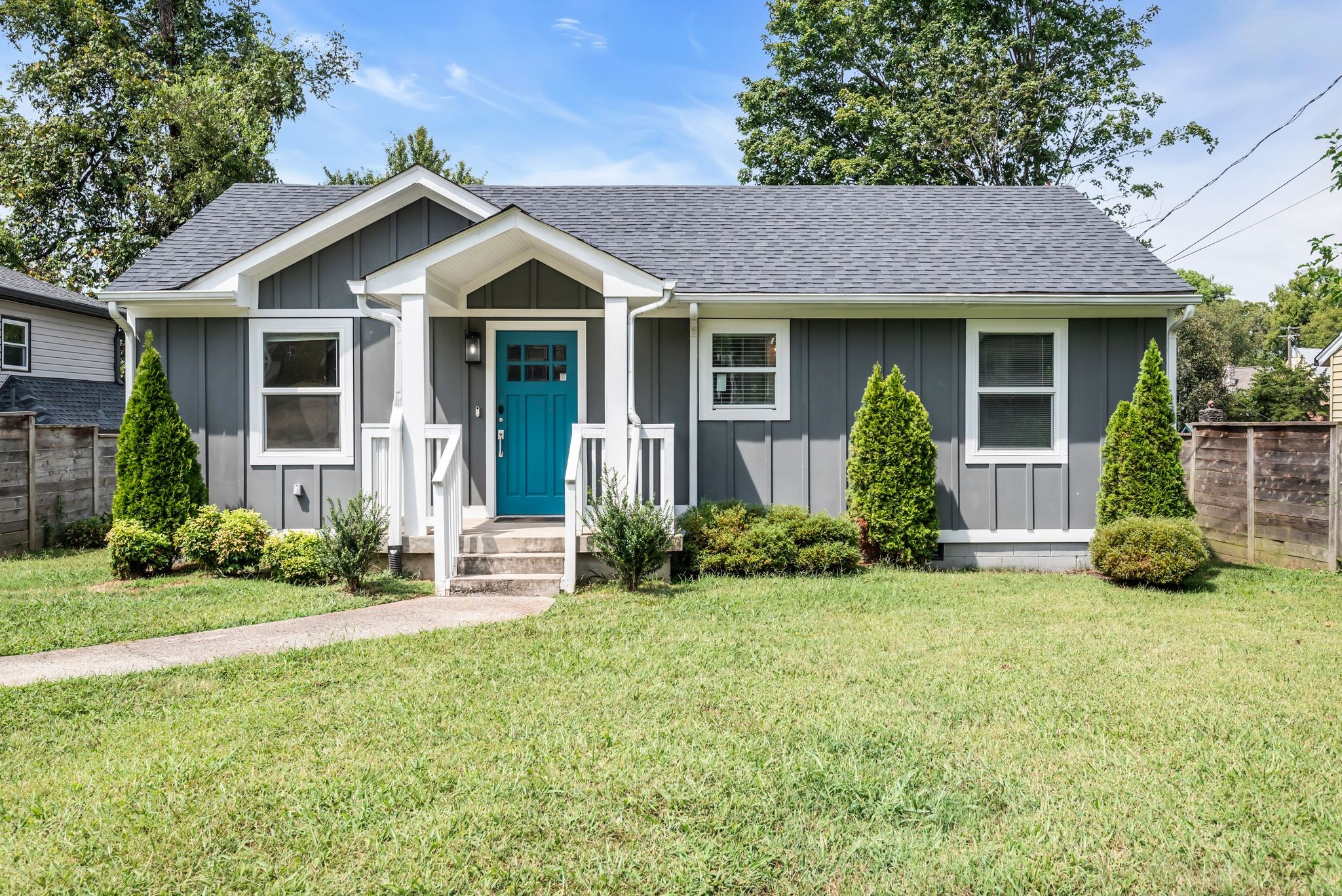 Welcome to your new home on a quiet cul-de-sac in East Nashville. This front porch fits two rocking chairs perfectly.