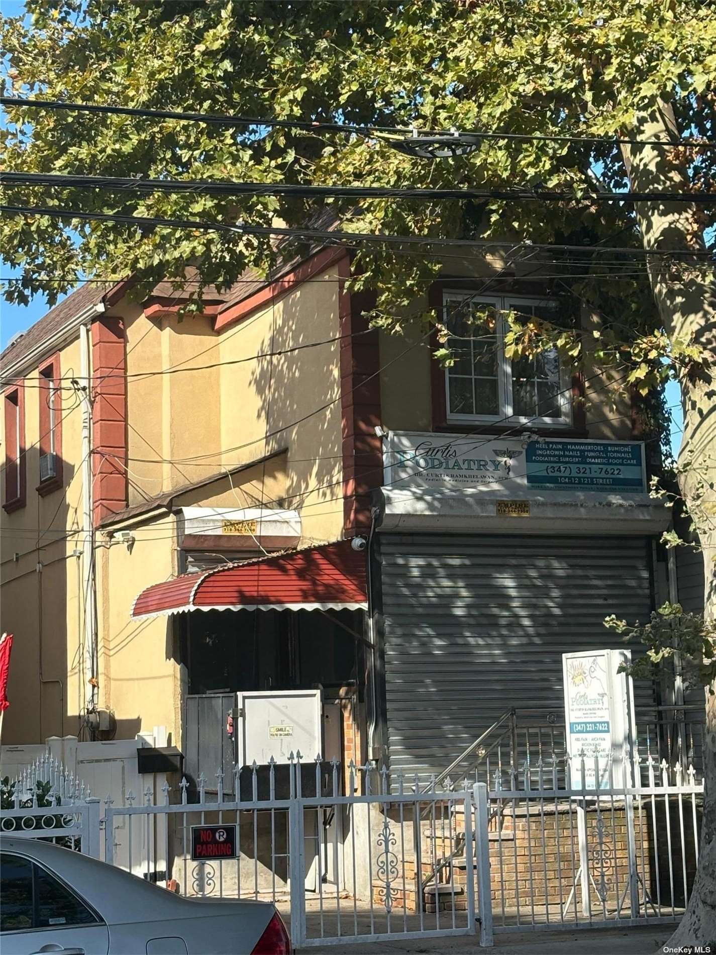 a front view of a house with parking