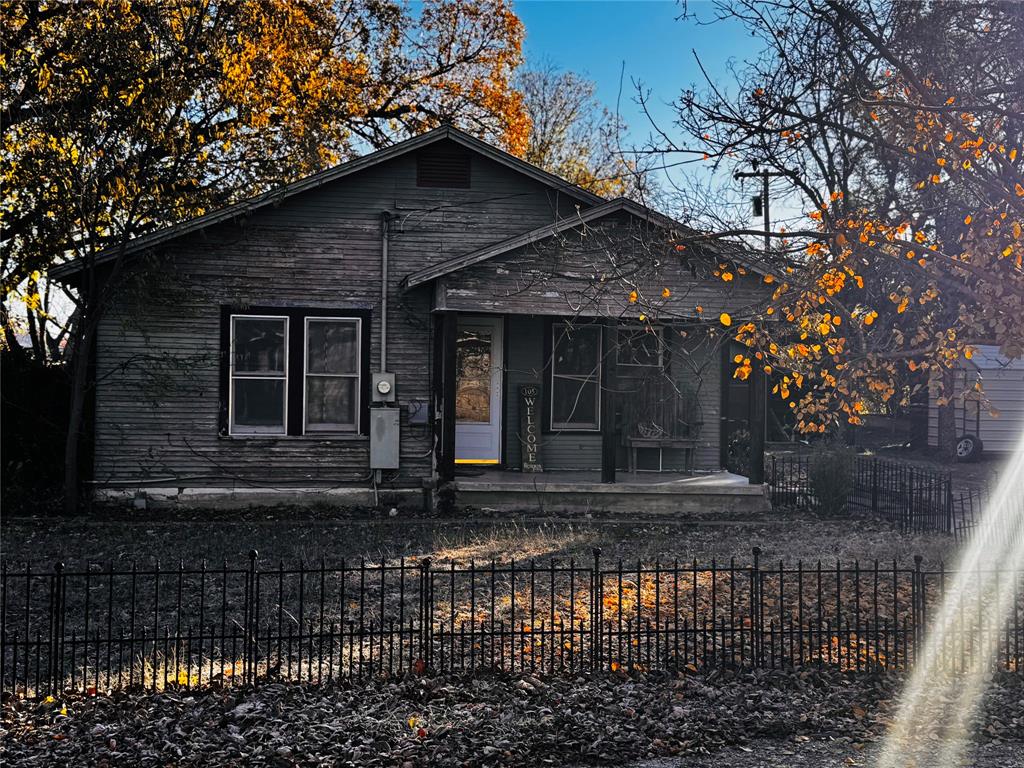 a front view of a house with yard