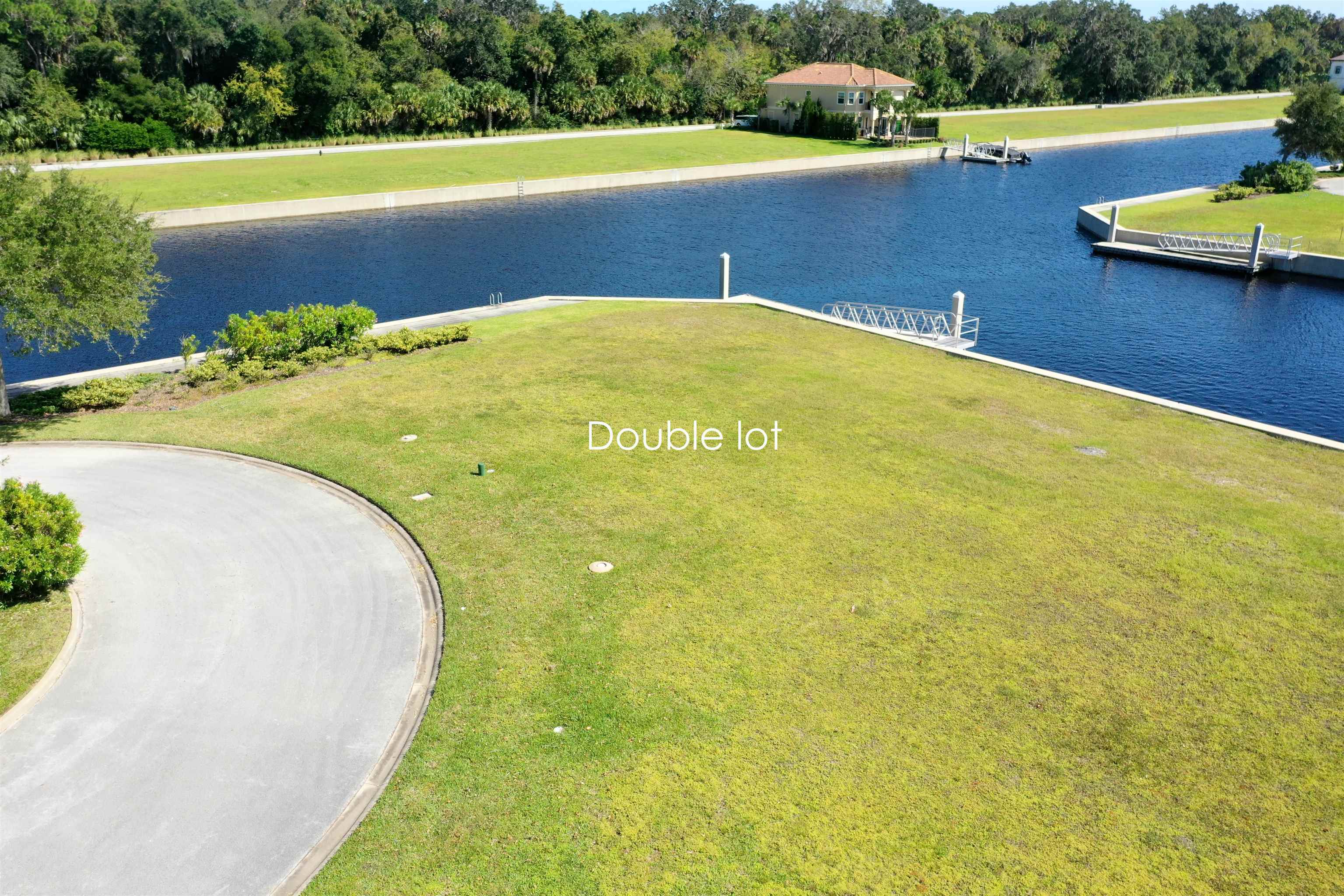 a view of a swimming pool with a yard