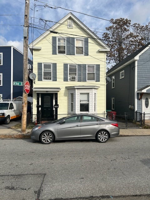 a front view of a house with parking space