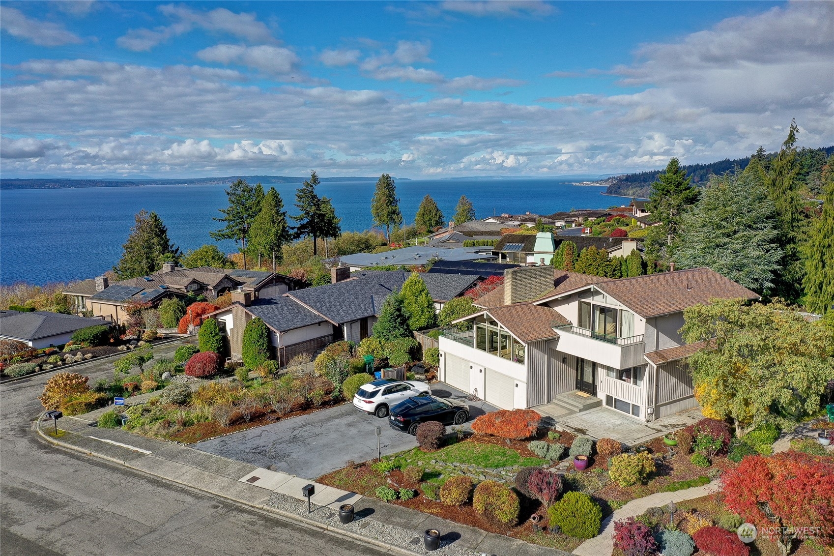 an aerial view of multiple houses with yard