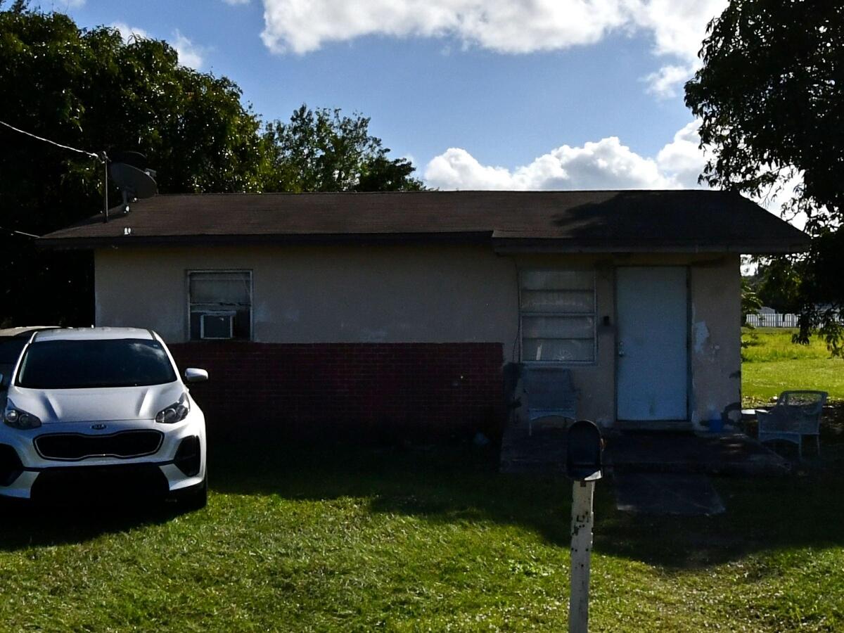 a car parked in front of a house