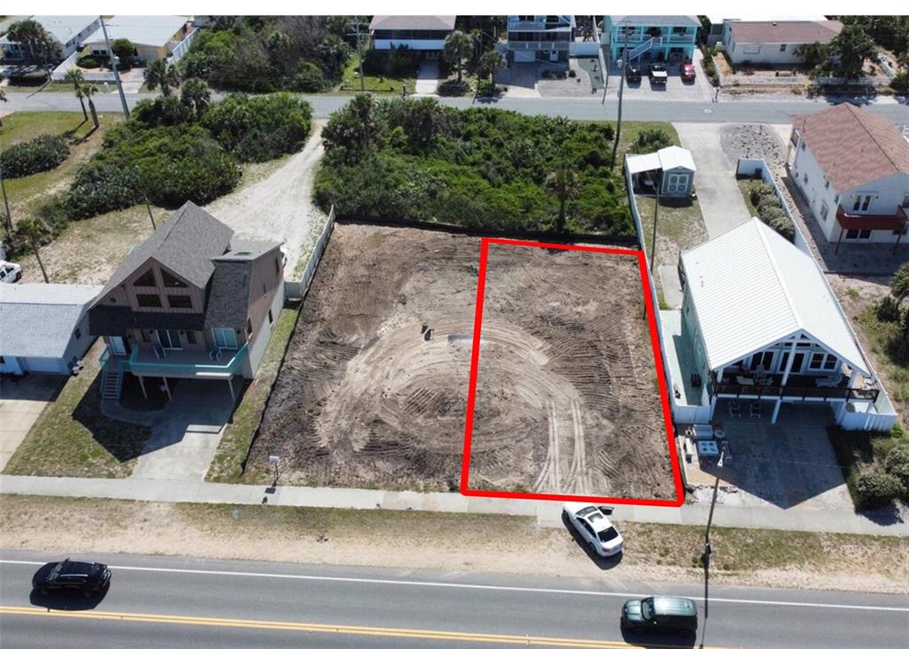 an aerial view of residential houses and outdoor space