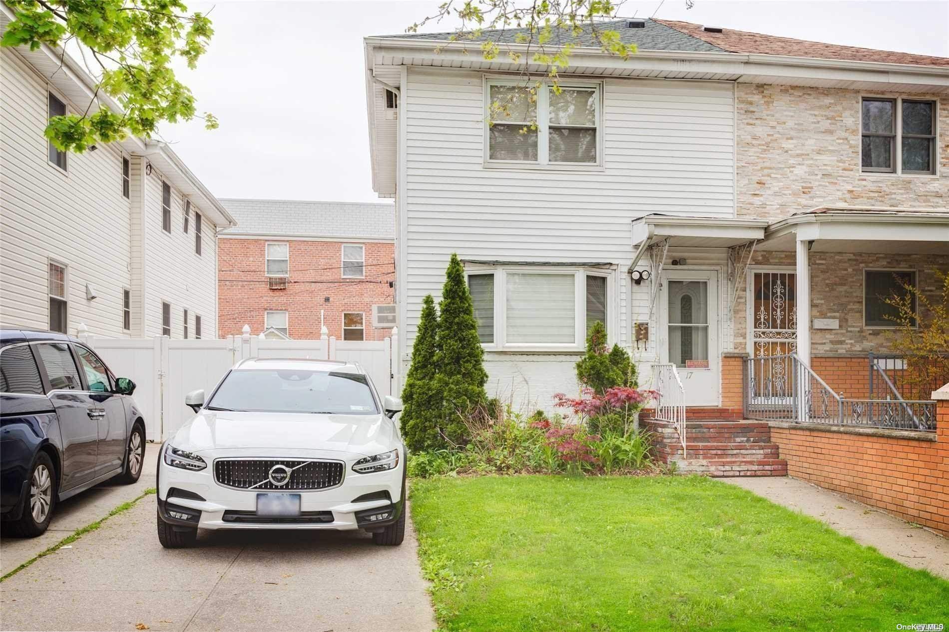 a car parked in front of a house