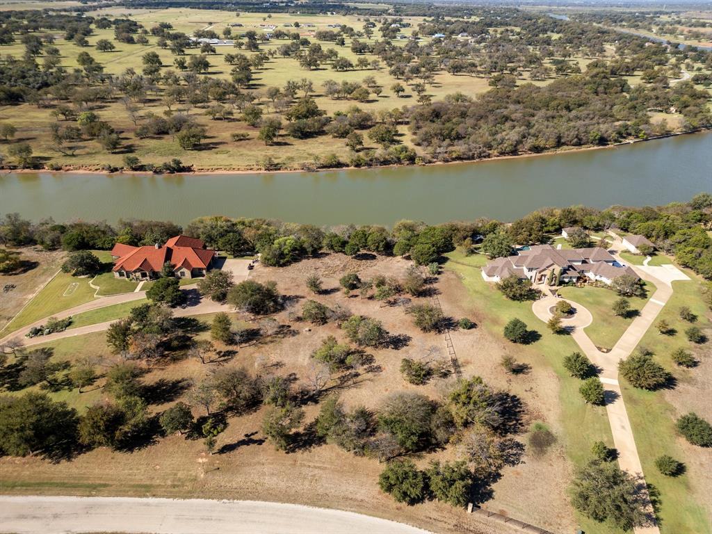 an aerial view of a house with a lake view