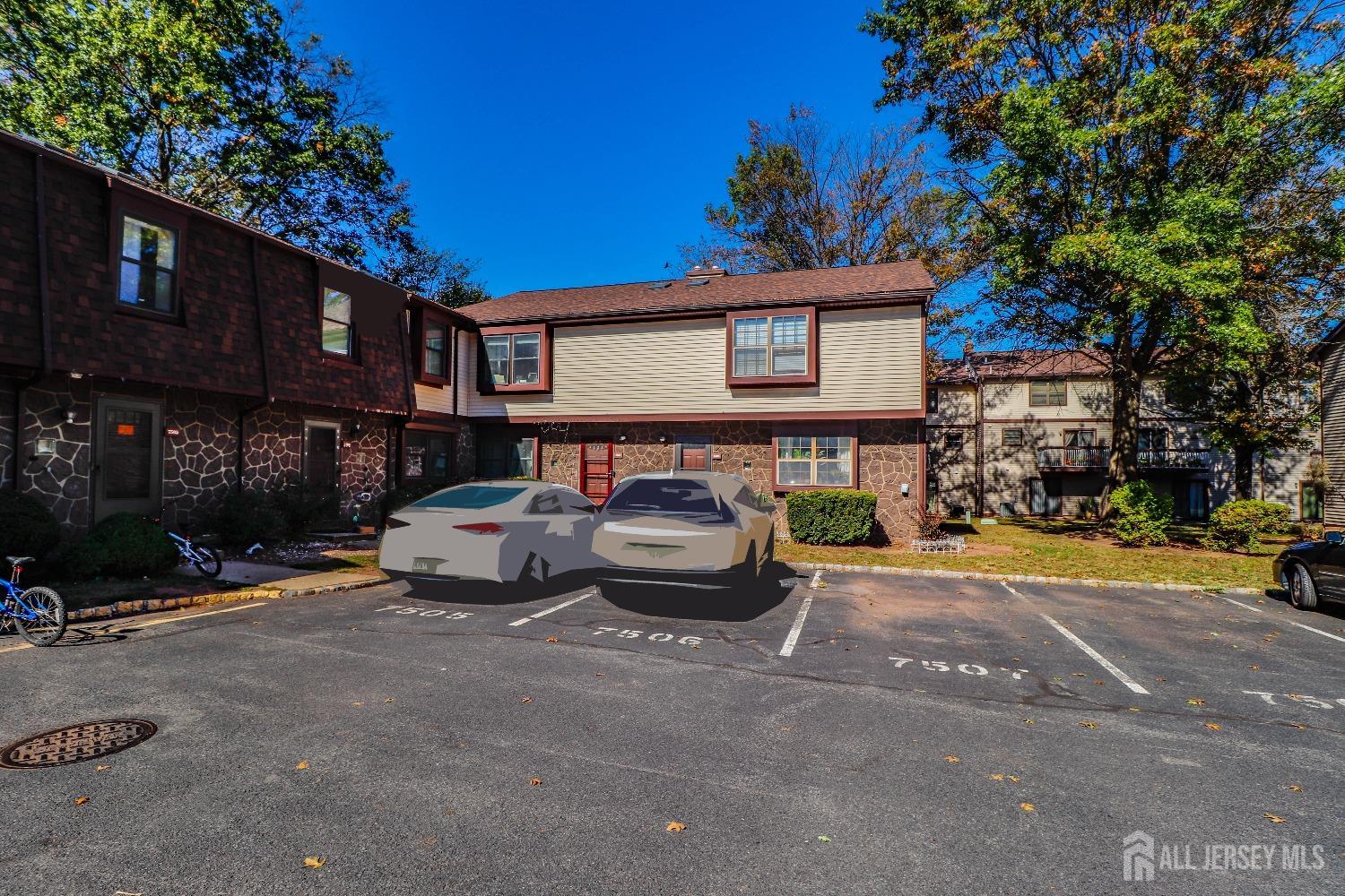 a front view of a house with parking