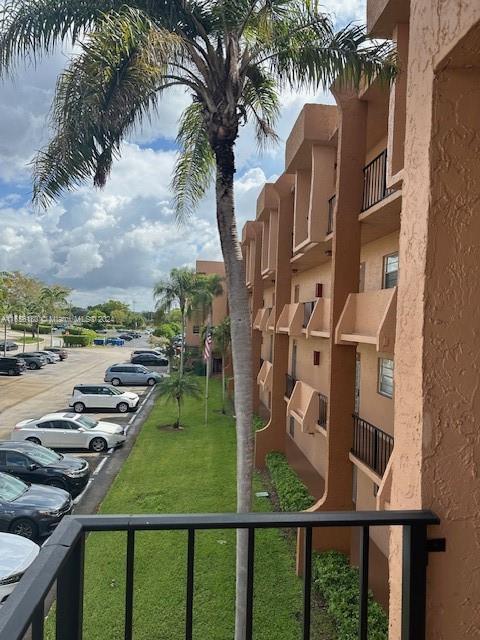 a view of swimming pool from a balcony