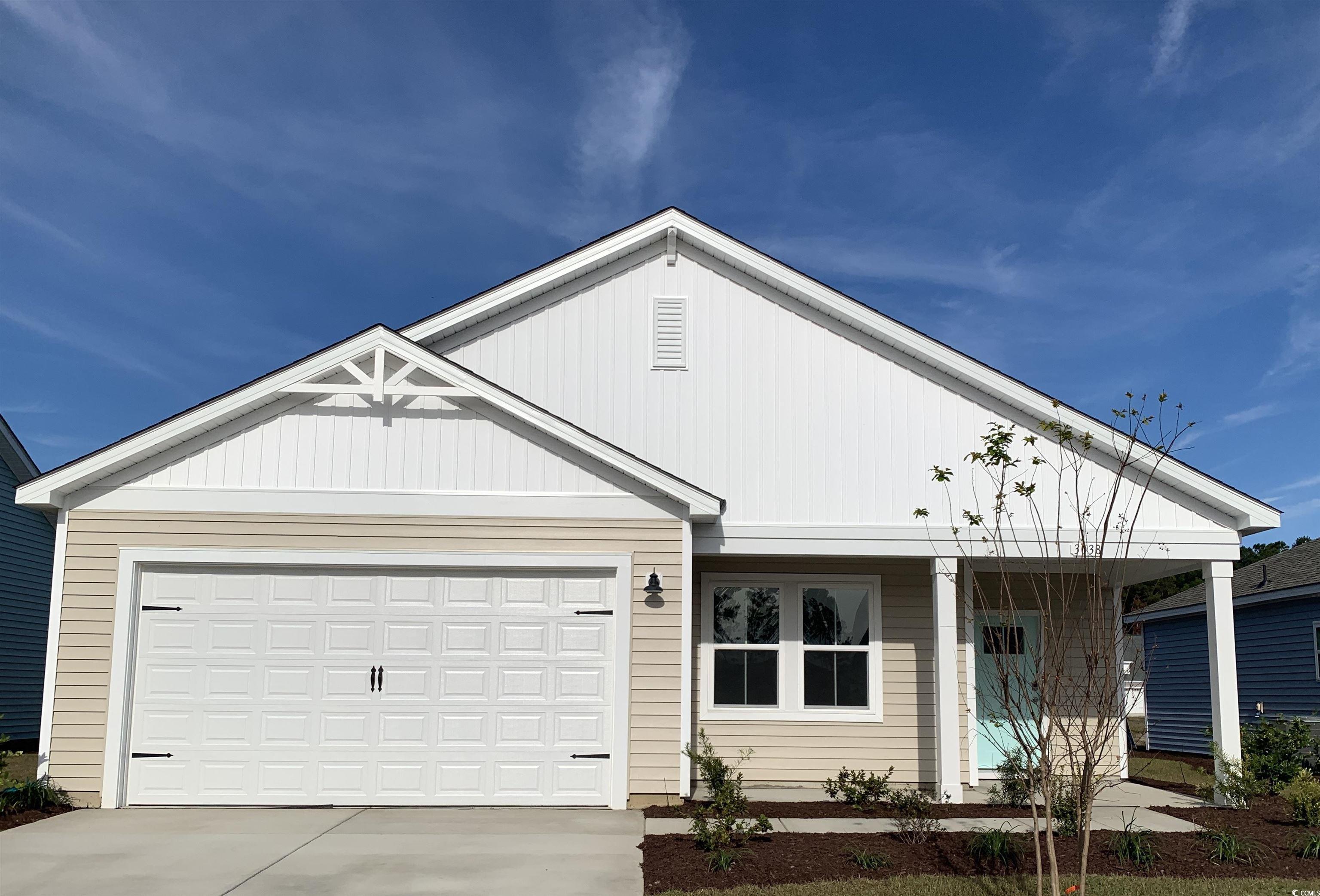 View of front of property featuring a garage