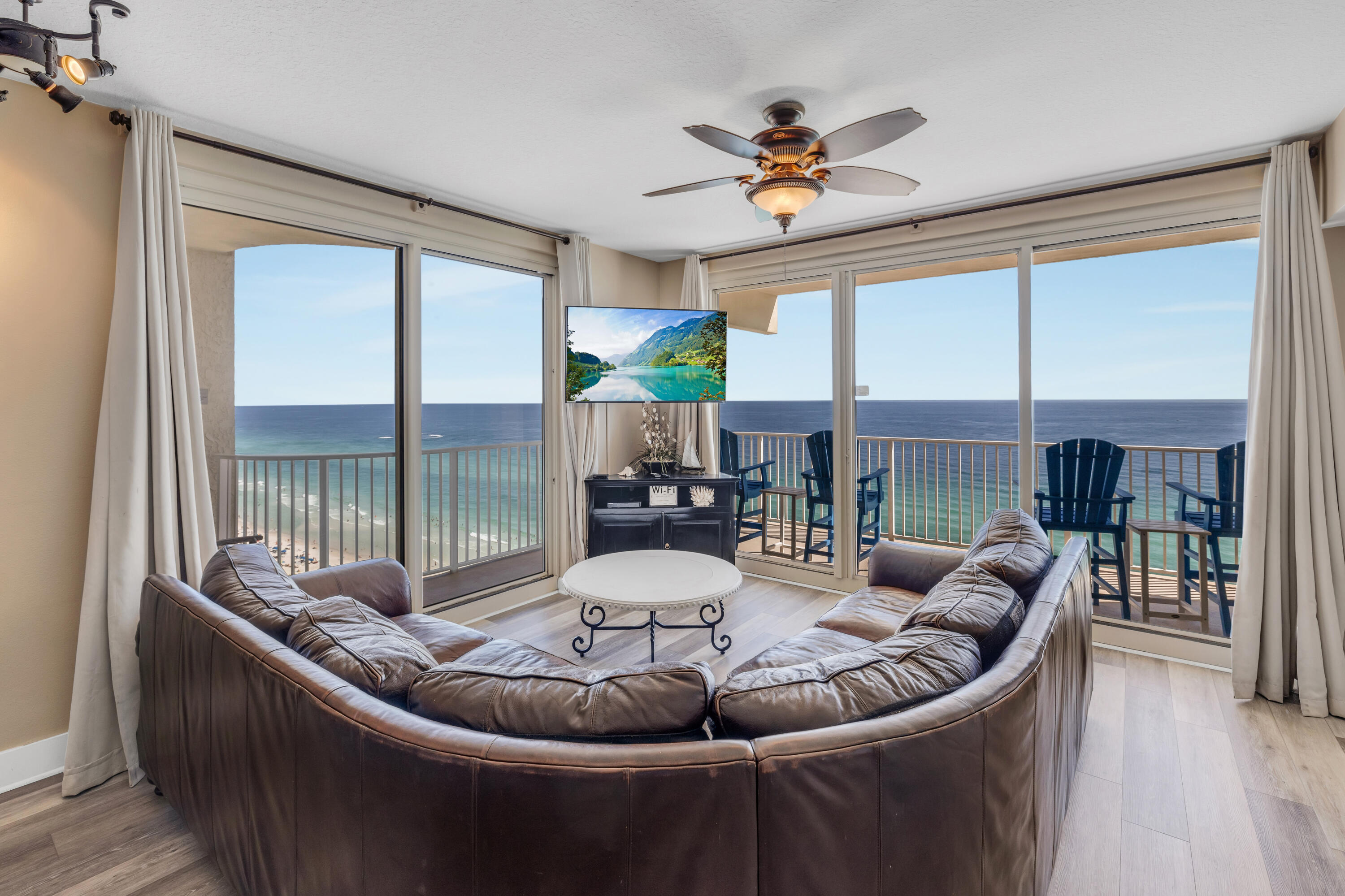 a living room with furniture and a large window