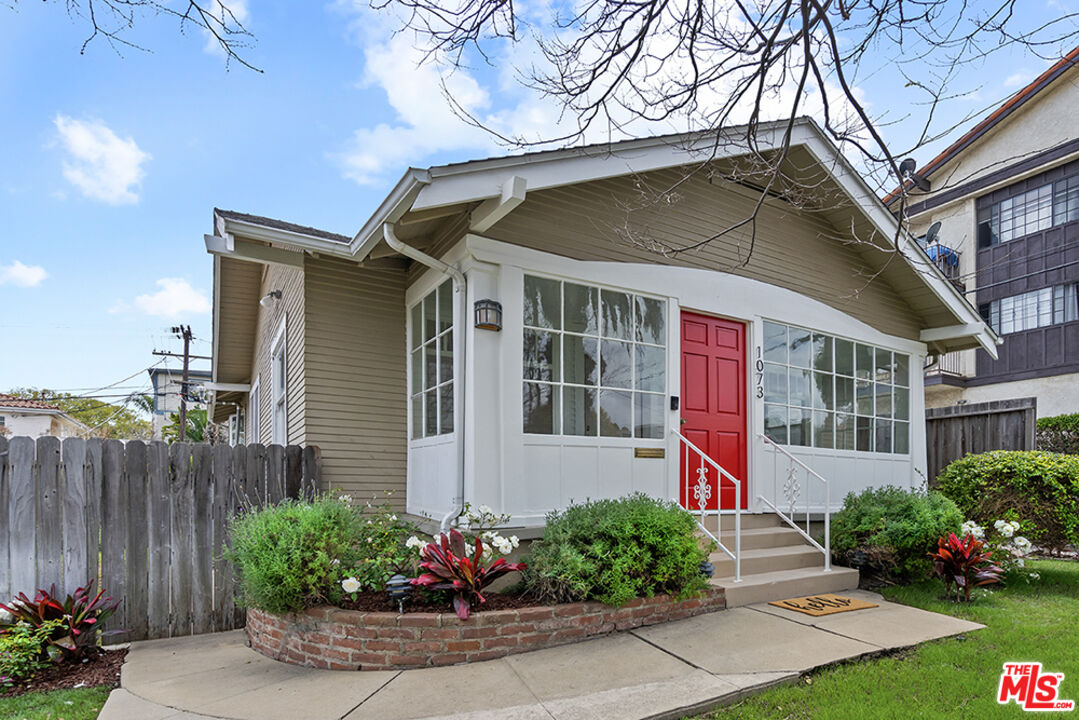 a house with a yard and a garden