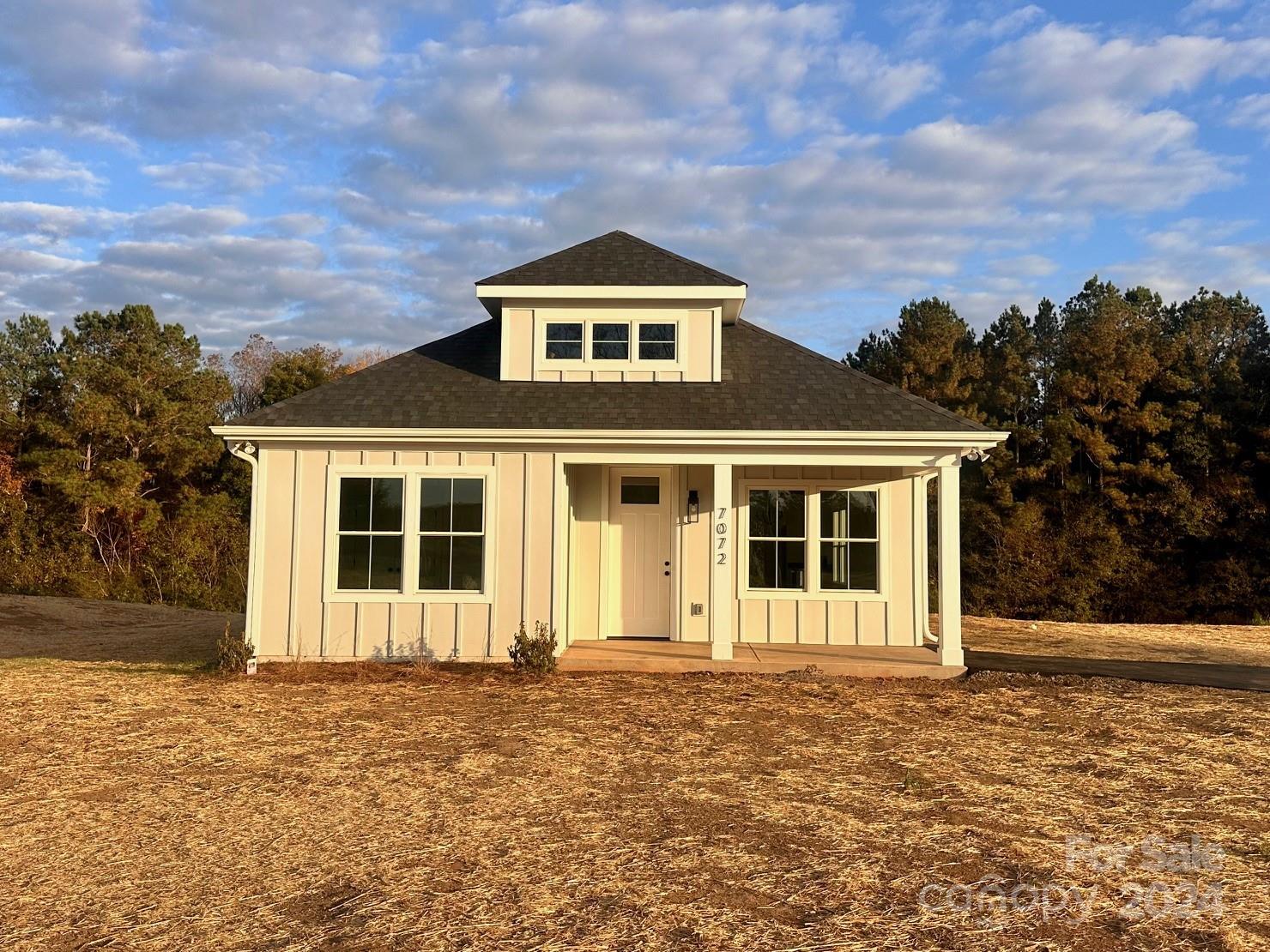 front view of a house with a yard