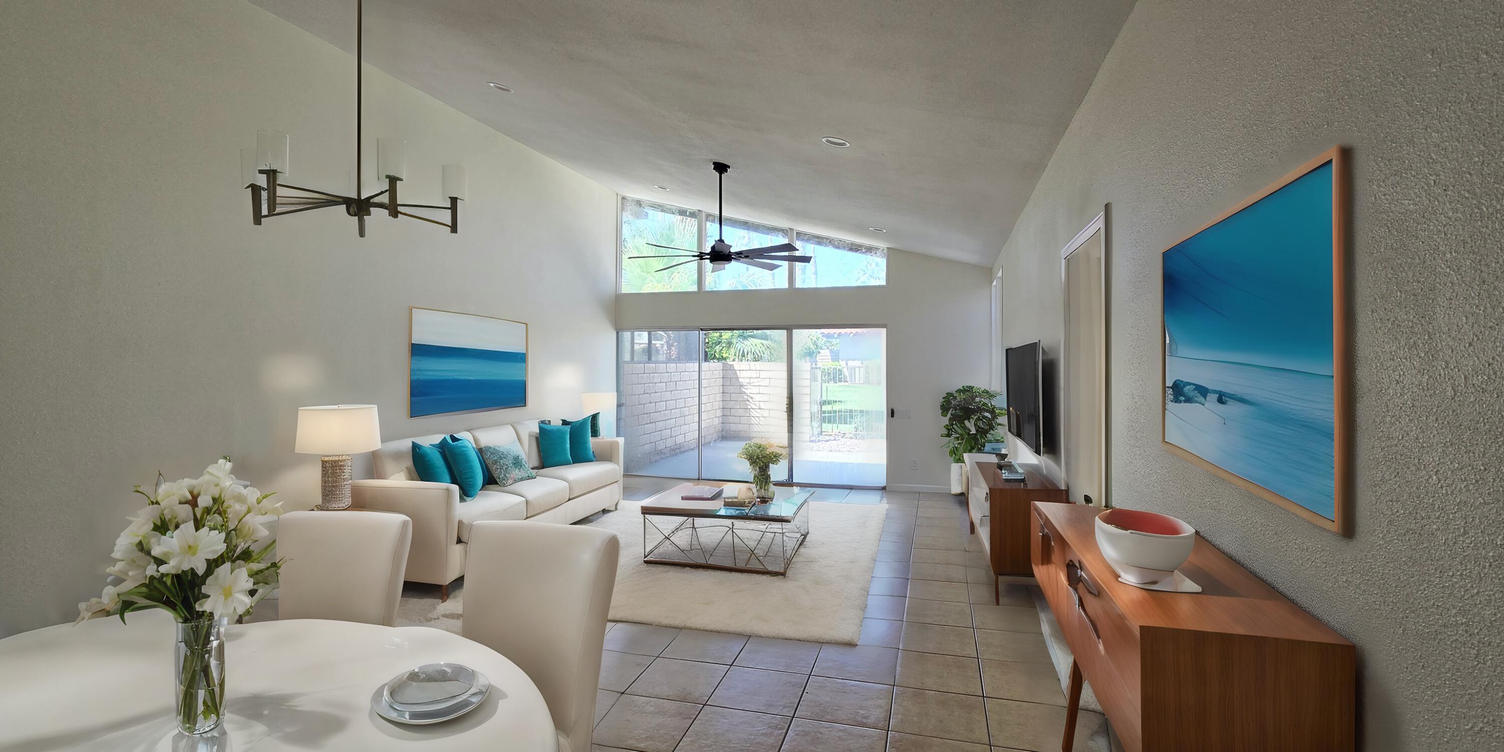 a living room with furniture a chandelier and a window