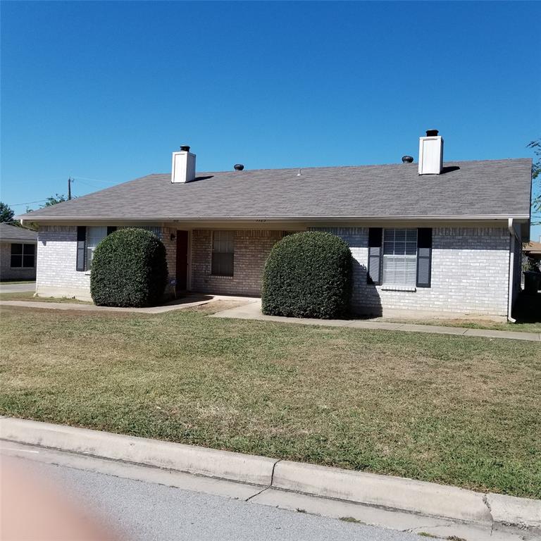 a front view of a house with garage