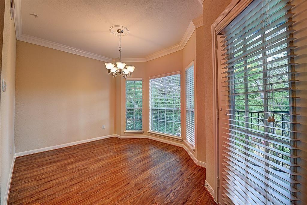 a view of a room with wooden floor and balcony