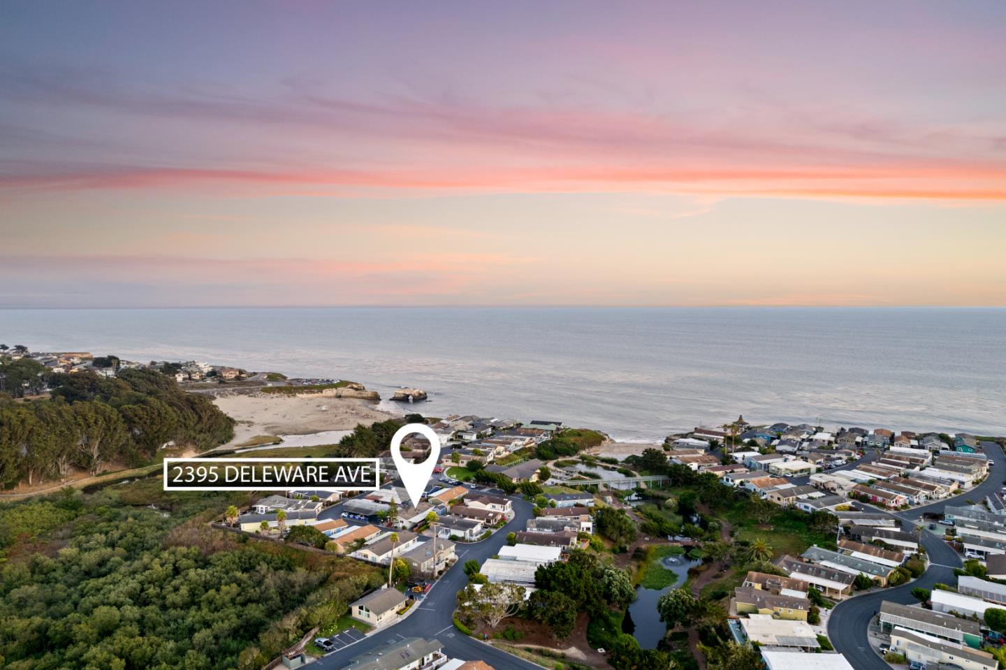 an aerial view of a city and ocean view